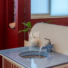 We explored the idea of "Indianness" in this bathroom vanity with vibrant hues and traditional motifs. The intricately patterned washbasin counter and unique tap design bring a regional style to life, adding an element of handcrafted intrigue.