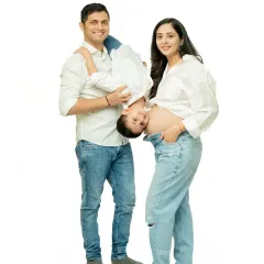 I love capturing playful, unposed moments like this. The father holding his son upside down brings genuine laughter and energy, showing the fun side of this growing family.