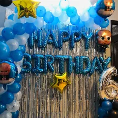 The Baby Boss theme is a fun choice for a little one's birthday. This decoration features a blue and white balloon backdrop, "Happy Birthday" letter foils, and multiple Baby Boss character balloons.