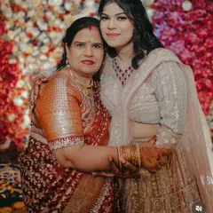A close-up of the mother and daughter, showing the different makeup styles that suit their individual preferences and ages.