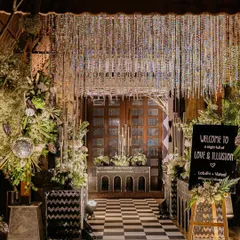 Welcome to a night of Love & Illusion. For this Sangeet, we designed a dramatic entrance with a checkered floor, a shimmering crystal curtain, and a welcome sign that set the tone for an unforgettable party. This is how we make an entrance.
