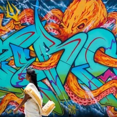 This mural in Nepal combines my signature lettering with a powerful octopus character, creating a dynamic piece for the MⒺTA-मोRPH-OSIS graffiti jam. It’s a great example of a large-scale character-based mural.