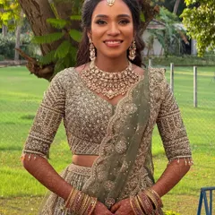 My beautiful glam bride Haritha looking stunning for her reception in Chennai. Her makeup is bold and defined, perfectly suited for her dusky skin tone and her intricately embroidered lehenga.