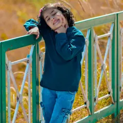 A perfect example of a natural light children's portrait. This was a completely candid moment, capturing a genuine smile during a relaxed outdoor family photoshoot. These are the memories that last a lifetime.