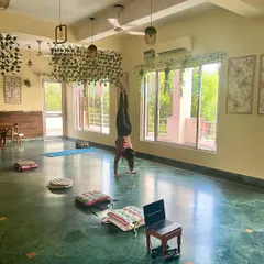 Playtime during pre-class preparation. A moment to practice handstands in our beautiful studio.