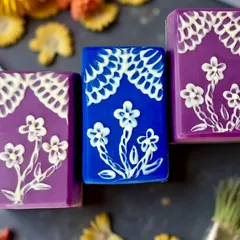 Another one of my brush embroidery soap designs. The technique is similar to decorating cookies, but working with soap batter is a completely different challenge. I love how the floral patterns turned out against the rich colors.