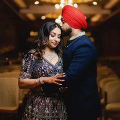 A tender moment from Mandeep and Priyanka's engagement. The forehead kiss is a classic pose that we capture with soft lighting to create a feeling of warmth and intimacy.