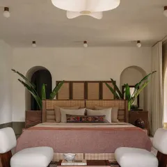 In this bedroom at the DUA Villa, we demonstrate how grand architectural concepts can translate into serene, intimate spaces. The design frames the view, making the lush exterior an integral part of the room's calm and restorative atmosphere.