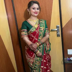 A full-length shot of the client, looking graceful and elegant in her saree.