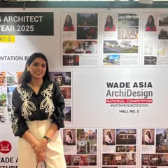 Surbhi Singhal standing before our presentation at WADE ASIA. We presented three projects that reflect our thoughtful, rooted, and enduring design approach.
