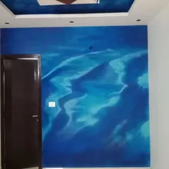 An abstract wall finish in deep and light blues, mimicking the look of rolling ocean waves or sand dunes. This free-form textured painting creates a calming and immersive atmosphere in the room.