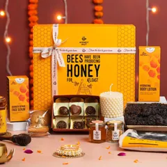 A beautifully styled group shot of a brand's Diwali hamper collection. We use festive props like diyas, lights, and flowers to create a complete celebratory scene.
