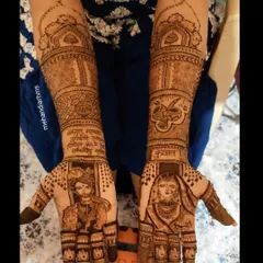 This bridal mehandi combines portraits of the couple with their names written in a beautiful script. The design also includes traditional symbols for a complete wedding look.