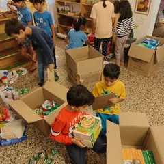 Children sort through donated goods for our Wayanad relief collection drive. They learn about organization, inventory, and the logistics of helping others.