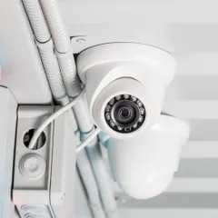 This is a close-up of a dome camera with powerful night vision capabilities. We use cameras that deliver sharp, detailed images in low-light conditions, ensuring no detail is missed.