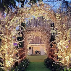 A fuller view of the rustic branch and blossom archway. The layered design and warm lighting create a deep, immersive tunnel effect that feels like stepping into a fairytale forest.