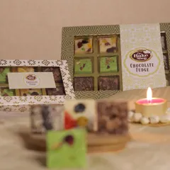 Dense, decadent, and dreamy, our chocolate fudge is available in beautiful gift boxes. A perfect treat for sharing during festive moments.