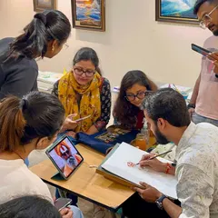 Guiding students during a figure painting session in Bangalore. My workshops are interactive, allowing for close observation and one-on-one feedback.