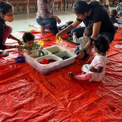 I love seeing parents and babies exploring together. I set up a dedicated area for the youngest children with age-appropriate sensory bins so they can play and learn at their own pace.