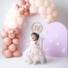 Pure excitement! This little princess is all smiles, celebrating her first birthday with a gorgeous pastel balloon setup.