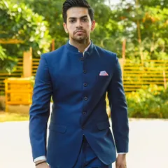 A model looking sharp and confident in our classic royal blue Jodhpuri suit. The bandhgala collar and tailored fit create a timelessly elegant and regal look, perfect for any formal Indian occasion.