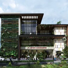 We designed the St. Xavier's Kindergarten as a modern institution for learning that feels both inspiring and welcoming. The building's facade combines natural elements, like a full-height vertical garden, with contemporary architectural lines and large glass panels to create a stimulating environment for children.