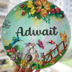 A whimsical nameplate for a child's room, featuring the name "Adwait" alongside a cute sculpted bunny, butterflies, and a fence. The soft green base and warm-toned flowers create a cheerful and playful scene.