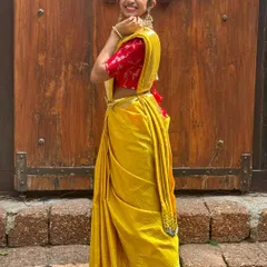 A full view of the beautiful yellow saree look for Day 1 of Navratri. The traditional drape and festive colors make it a perfect celebration outfit.