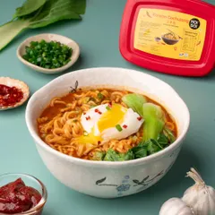 A perfect bowl of Korean ramen that looks both comforting and delicious. We styled this shot for Moi Soi to highlight their Gochujang paste, balancing vibrant colors, fresh ingredients, and a perfectly poached egg to make you want to dig right in.