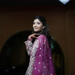 A beautiful candid shot of the bride-to-be at her engagement party. The makeup is soft and romantic, with a focus on enhancing her natural features.
