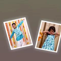 I craft each piece of clothing with love, and my twinning sets are no exception. This brother and sister look adorable in their coordinated blue floral outfits.