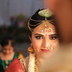 A classic South Indian bridal look, focusing on radiant skin and captivating eyes. This is all about creating that timeless, elegant glow for your big day.