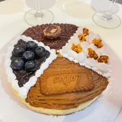Another look at our popular four-flavour baked cheesecake, combining Nutella, blueberry, salted caramel, and Biscoff. It's a party on a plate, perfect for sharing or enjoying all by yourself.