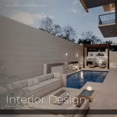 This poolside lounge is designed for ultimate comfort and relaxation. It features a long, built-in sofa, a modern pergola for partial shade, and a seamless transition from the paved deck to the water's edge.