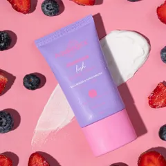 Texture is everything in skincare photography. This shot showcases the creamy consistency of an Aqualogica product against a backdrop of fresh berries.