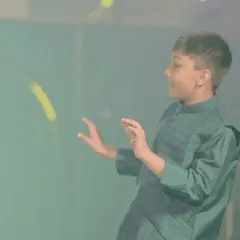 A young performer completely in his element on stage. Choreographing for kids is all about making it fun and letting their personalities shine.