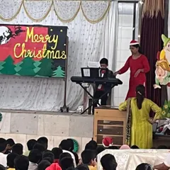 Our young musician, Aaden Fernandes, performs Christmas carols for his entire school at St. Anthony's High School. He confidently played the keyboard for a large audience, spreading holiday cheer.