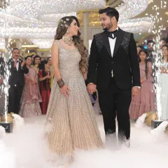 The grand entrance of the couple at their reception, complete with cold pyro and smoke effects. We are equipped to capture the scale and excitement of large-scale wedding celebrations.