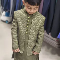 A full look at the custom-tailored olive green Indo-Western outfit for one of my youngest clients. The jacket features a subtle pattern and is paired with a matching kurta.