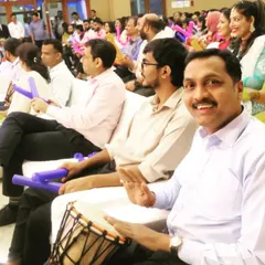A candid shot from a Suryoday Bank anniversary event, where employees participated in a team-building drum circle. I focus on capturing genuine expressions of joy and engagement, delivering photos that feel authentic and full of life.