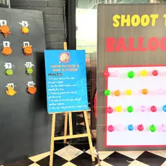 Fun and games at the art party, featuring a "Little Punch & Get A Punch" prize game and a "Shoot the Balloon" activity. We can arrange these interactive game stalls to add an extra layer of entertainment to any celebration.