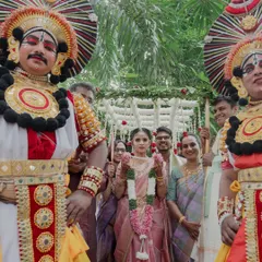 The bride's grand entrance led by Yakshagana performers. Incorporating traditional art forms like this creates a majestic and culturally rich spectacle that leaves a lasting impression on guests.