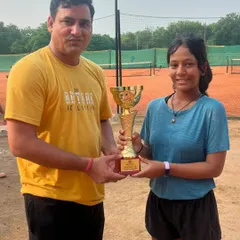 Eshanya Khattar, winner of the U18 Girls' title, proudly holds her trophy. This is one of many outstanding performances by our players at recent UTR tournaments.