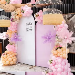 A glimpse of the beautiful "Baby in Bloom" decor. The elegant balloon arches in pastel colors set a festive and celebratory mood for the baby shower.