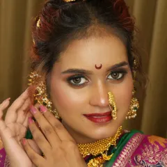 A detailed shot of the eye makeup and jewelry. Learning to work with different skin tones and face shapes is a core part of my advanced bridal makeup course.