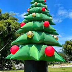 Another view of the giant inflatable Christmas tree, set up outdoors in a park. It's a great centerpiece for any holiday decoration.