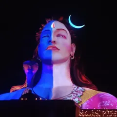 A stunning view of the Adiyogi light show, where vibrant colors paint the night sky. This is a truly divine and artistic experience.