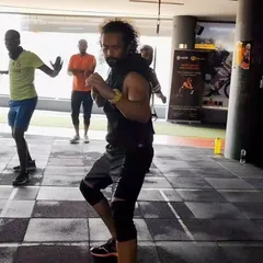 A snapshot from one of our dynamic group classes. Members practice their fighting stance and footwork, a fundamental part of our MMA fitness curriculum that builds a strong foundation for all levels.
