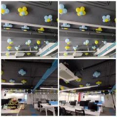 More views of the Zolostays anniversary, focusing on the ceiling decor. I used simple balloon flowers and scattered balloons to add a festive touch above the workstations without obstructing the space.
