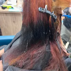 The reality of a major color correction. This is the "before" stage, showing our willingness to take on challenging jobs to give you the hair you want.